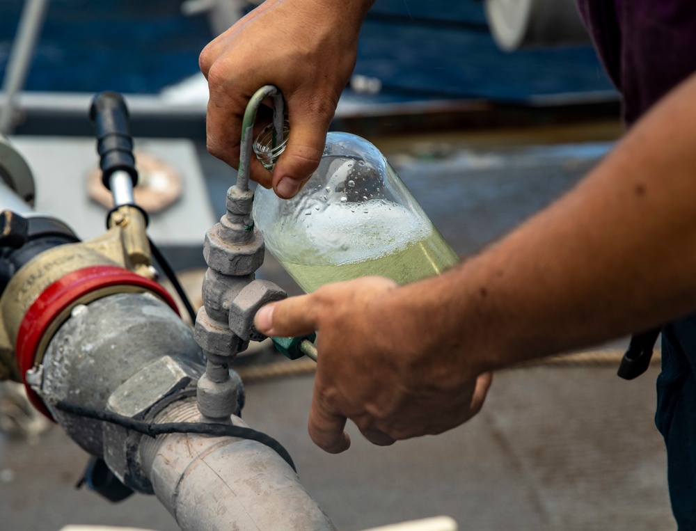 Sailors Aboard USS Dewey (DDG 105) Conduct Replenishment-at-Sea with USNS Tippecanoe (T-AO 199)