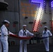 Sailors from Abraham Lincoln lower the national ensign during RIMPAC 2022