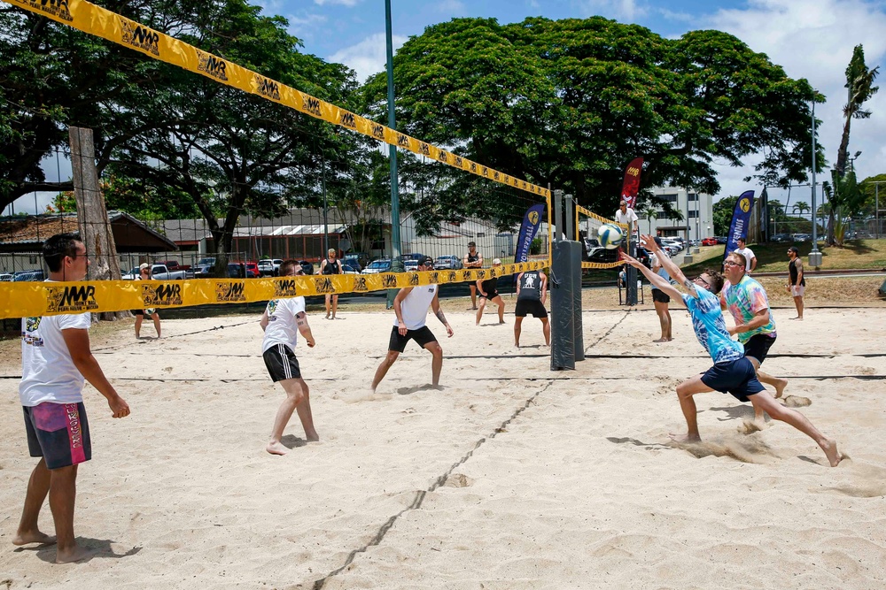 U.S. Navy Sailors from Abraham Lincoln, William P. Lawrence compete in a volleyball game during RIMPAC 2022