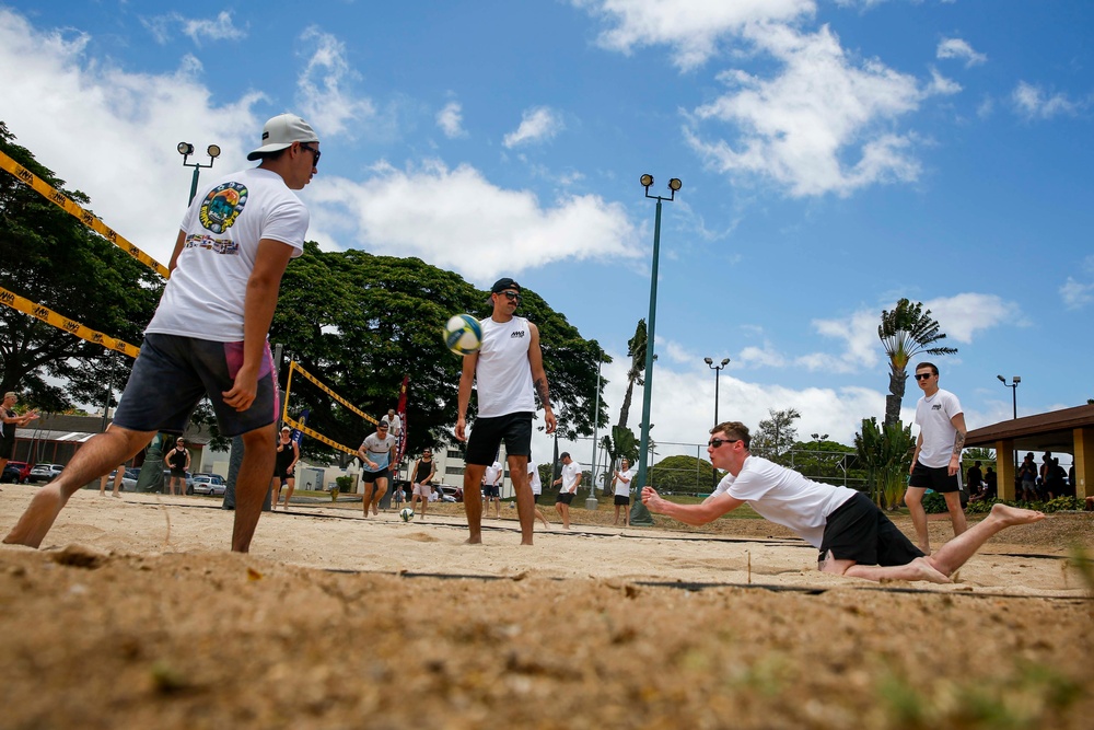 U.S. Navy Sailors from Abraham Lincoln, William P. Lawrence compete in a volleyball game during RIMPAC 2022