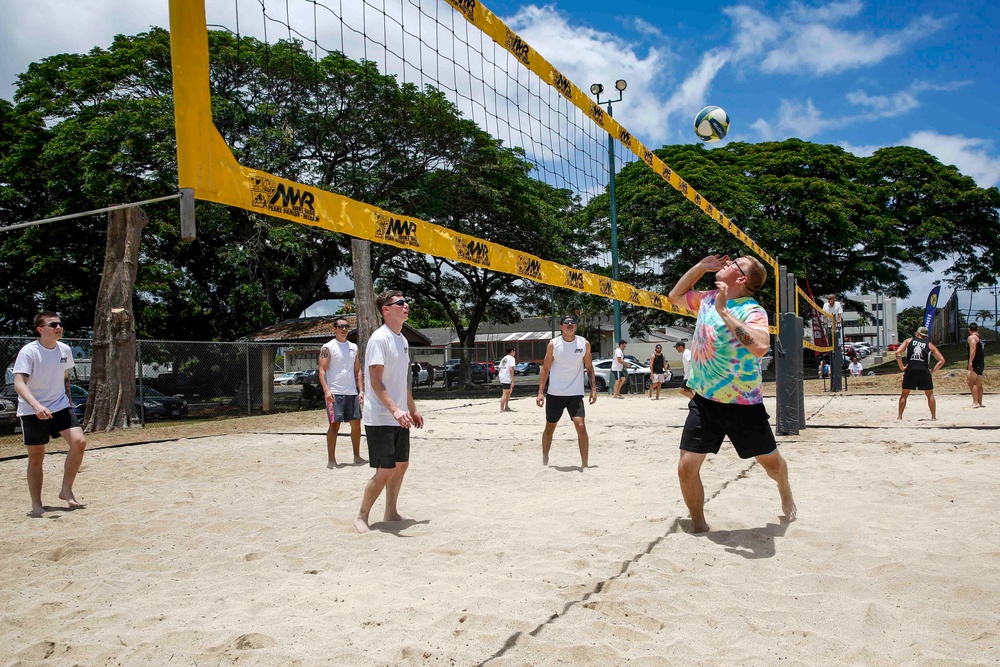 U.S. Navy Sailors from Abraham Lincoln, William P. Lawrence compete in a volleyball game during RIMPAC 2022