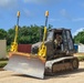 NMCB THREE Seabees conduct operations check on dozer after installing tremble earthworms system.