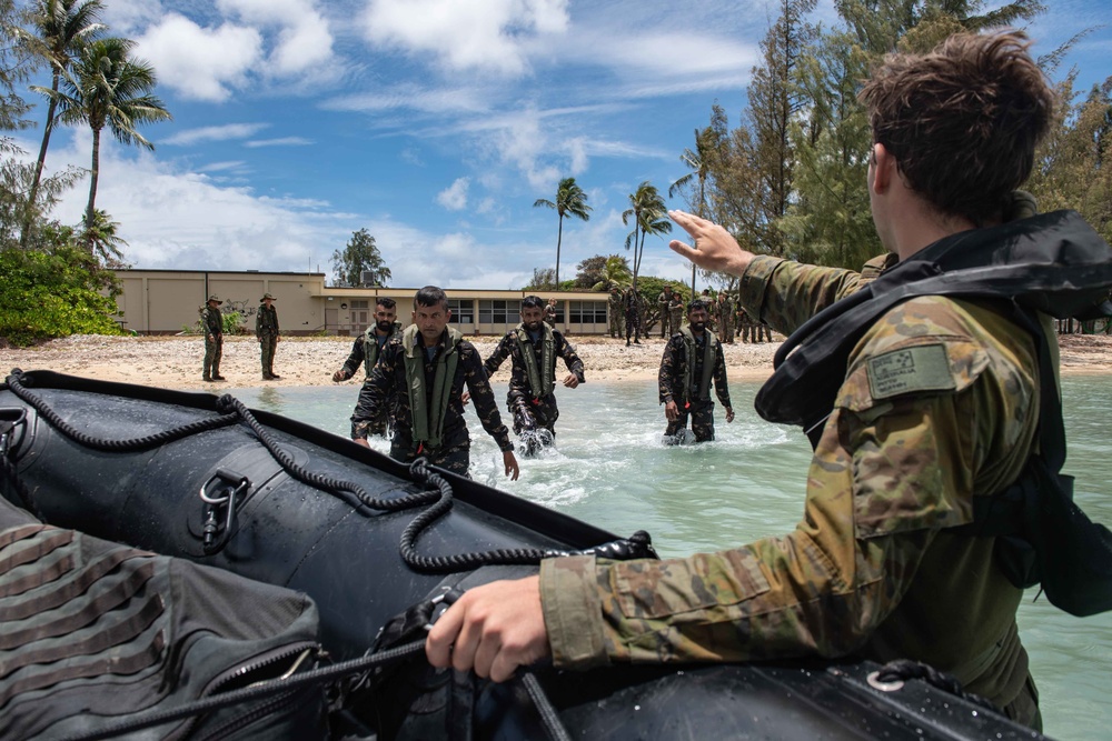 Australian Army Soldier Pte. Jackson Pitts instructs Sri Lankan Marines for a man overboard exercise in an F470 Zodiac RIMPAC 2022