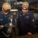 USS Ronald Reagan (CVN 76) Sailors braze pipes in the machine shop