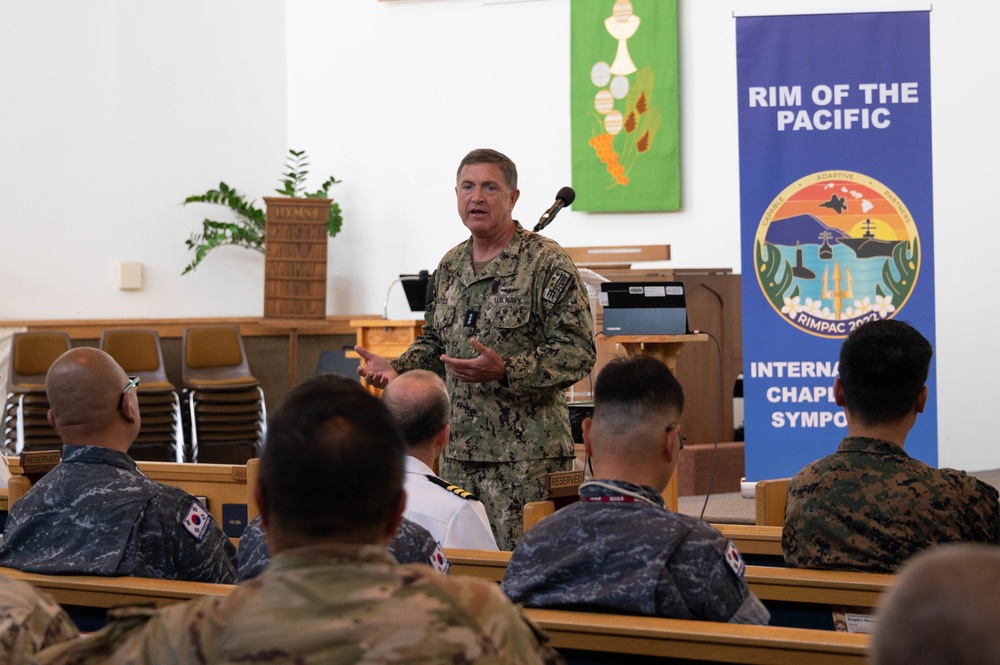 Vice Adm. Michael Boyle speaks during international chaplaincy symposium during RIMPAC 2022