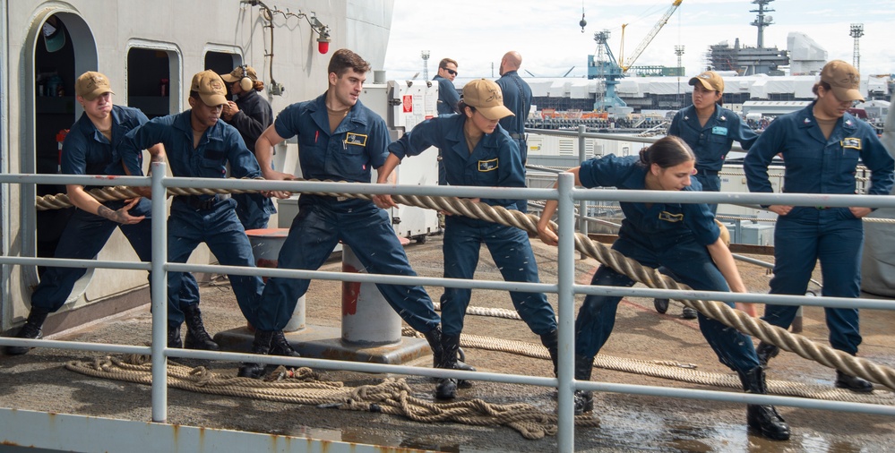 Sailors Heave Around A Line