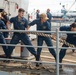 Sailors Heave Around A Line