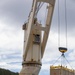 Sailors provide cargo handling and transportation services of ammo ISO containers aboard MV Ocean Glory