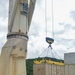 Sailors provide cargo handling and transportation services of ammo ISO containers aboard MV Ocean Glory