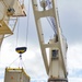 Sailors provide cargo handling and transportation services of ammo ISO containers aboard MV Ocean Glory