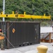 Sailors provide cargo handling and transportation services of ammo ISO containers aboard MV Ocean Glory