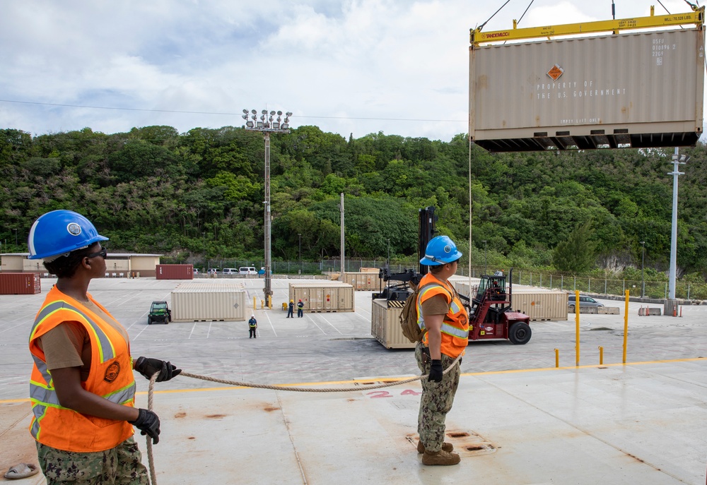 Sailors provide cargo handling and transportation services of ammo ISO containers aboard MV Ocean Glory