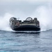 Marines onload equipment to the USS Makin Island with LCACs