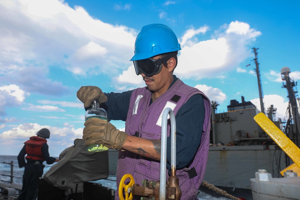 USS Cole Conducts a replenishment at sea with USNS Supply