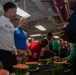 USS Ronald Reagan (CVN-76) Sailors hold a watermelon eating competition