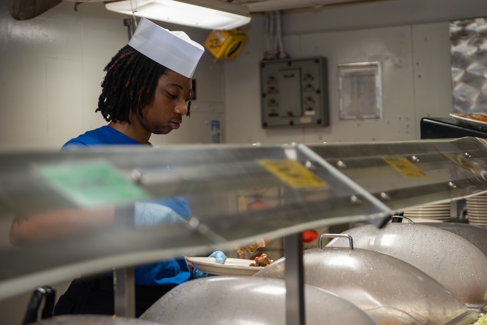 USS Ronald Reagan (CVN-76) food service Sailors serve meals