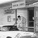 Today’s curbside pickup program had its roots in military commissaries with branch stores that functioned as drive-in outlets