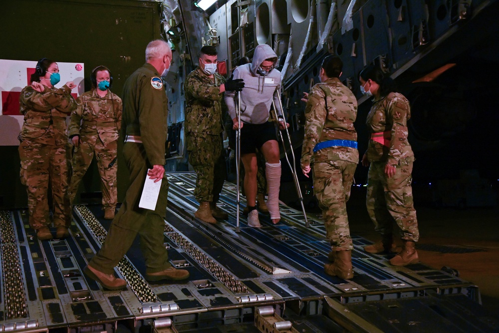 316th OMRS En-Route Patient Staging Facility team transports wounded service members