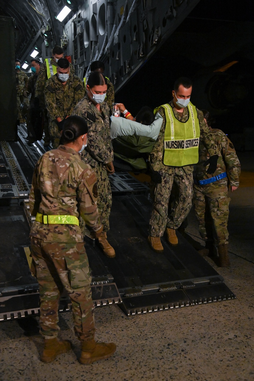 316th OMRS En-Route Patient Staging Facility team transports wounded service members