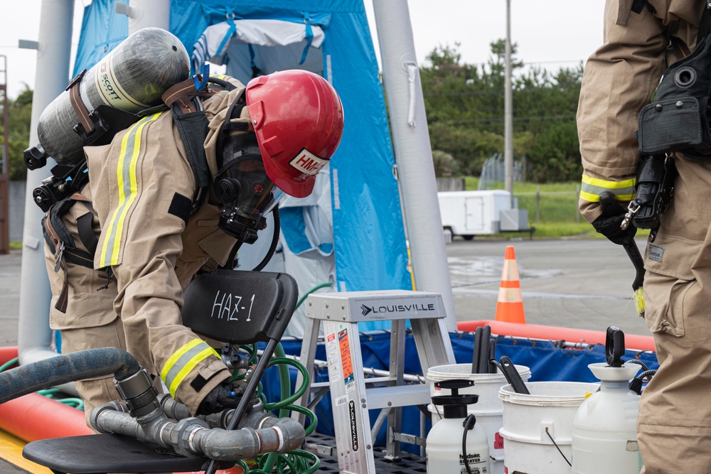 Firefighters and Engineers from Marine Corps Installation Pacific Fire and Emergency Services conduct HAZMAT training