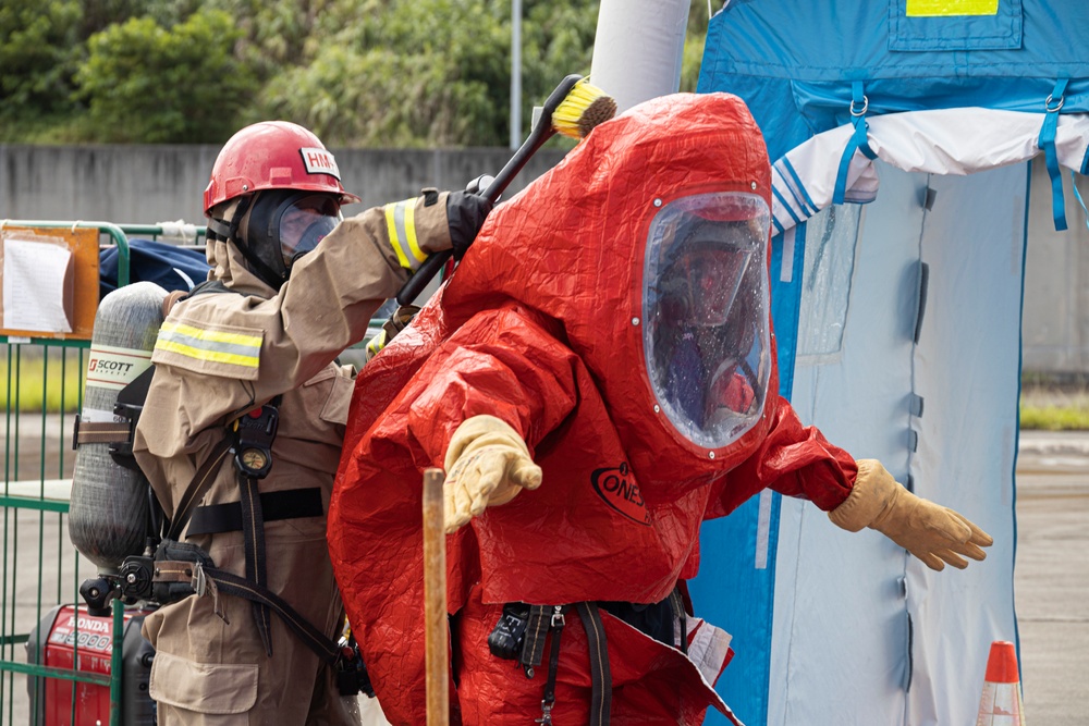 Firefighters and Engineers from Marine Corps Installation Pacific Fire and Emergency Services conduct HAZMAT training