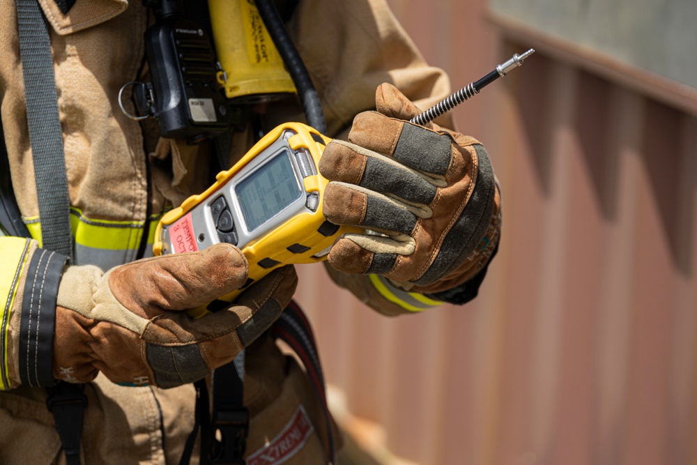 Firefighters and Engineers from Marine Corps Installation Pacific Fire and Emergency Services conduct HAZMAT training