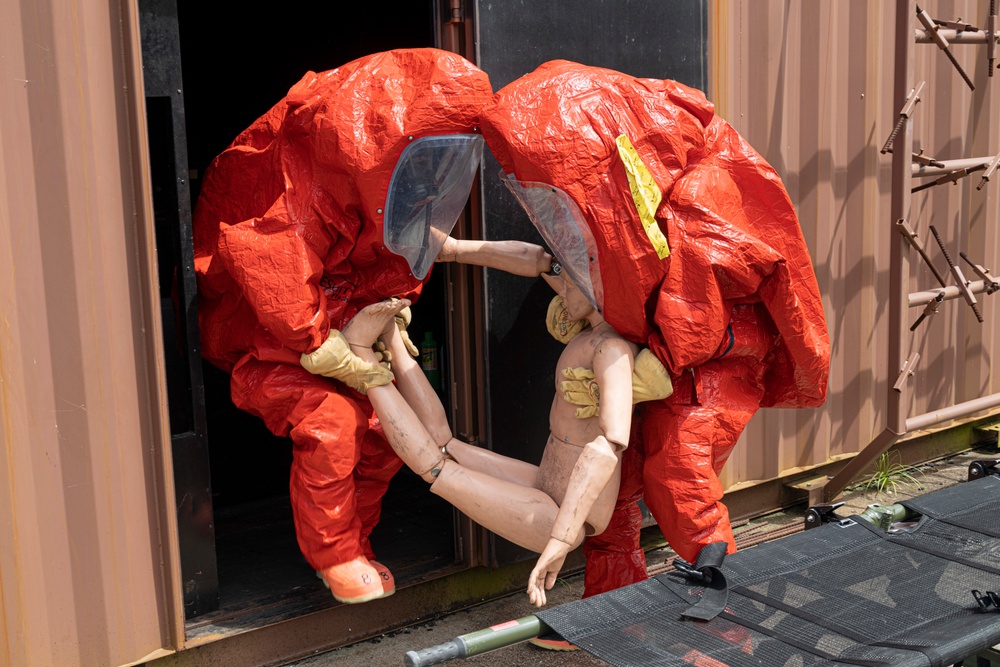 Firefighters and Engineers from Marine Corps Installation Pacific Fire and Emergency Services conduct HAZMAT training