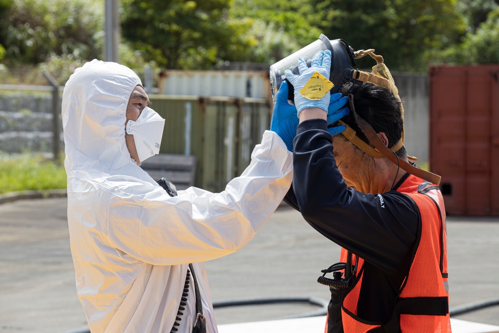 Firefighters and Engineers from Marine Corps Installation Pacific Fire and Emergency Services conduct HAZMAT training