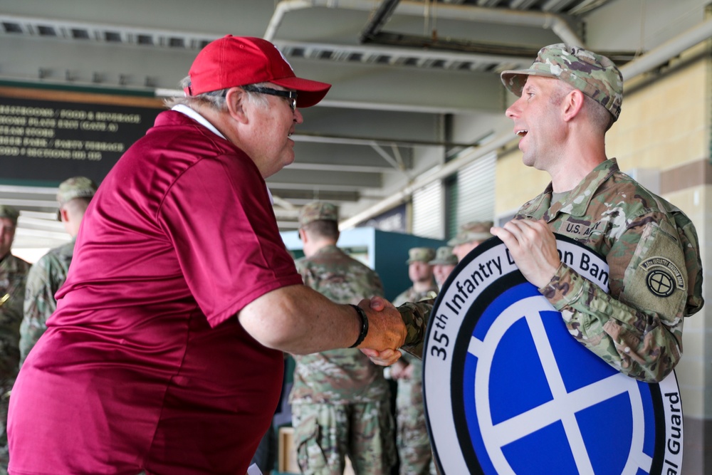 35th Infantry Division Band plays the national anthem at the Kansas City Monarchs baseball game