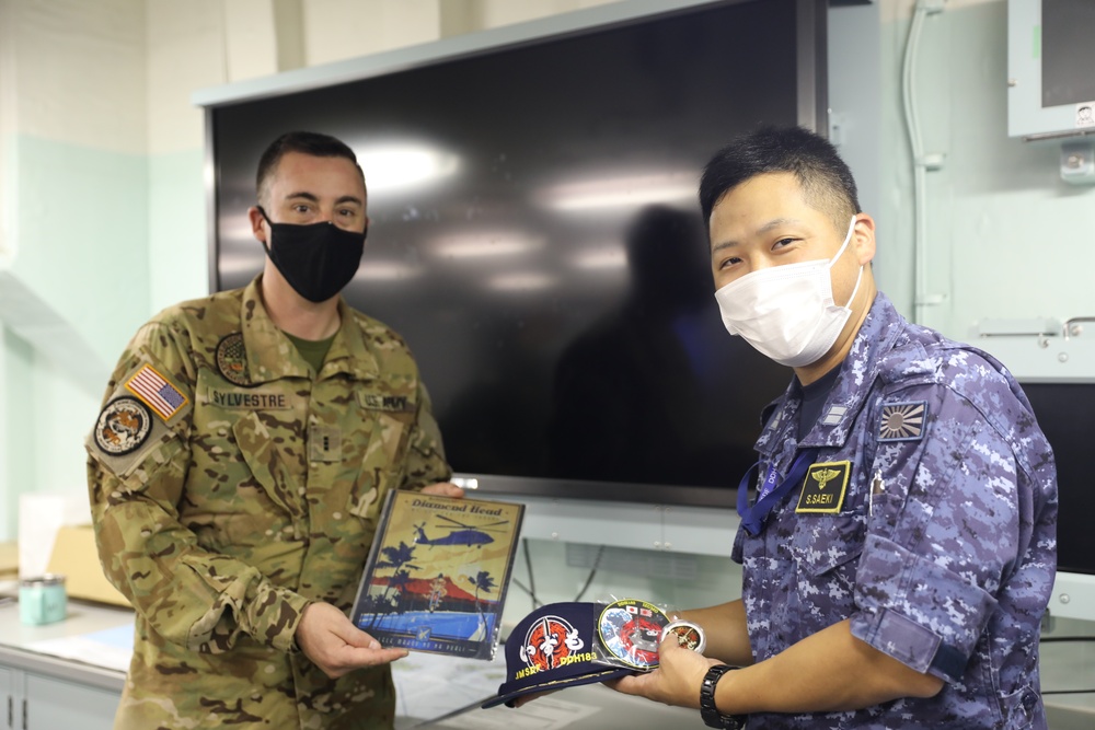 Gift exchange during cross deck walk for Rim of the Pacific (RIMPAC) 2022