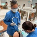 Dental students practice their skills while treating Soldiers, dependents, and retirees