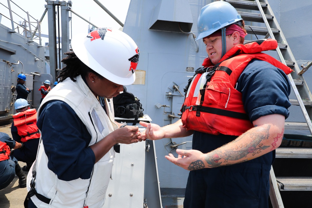 Hospital Corpsman Assigned to USS Truxtun (DDG 103) Renders Aid