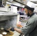 Culinary Specialist Prepares Food Aboard the USS Truxtun (DDG 103)