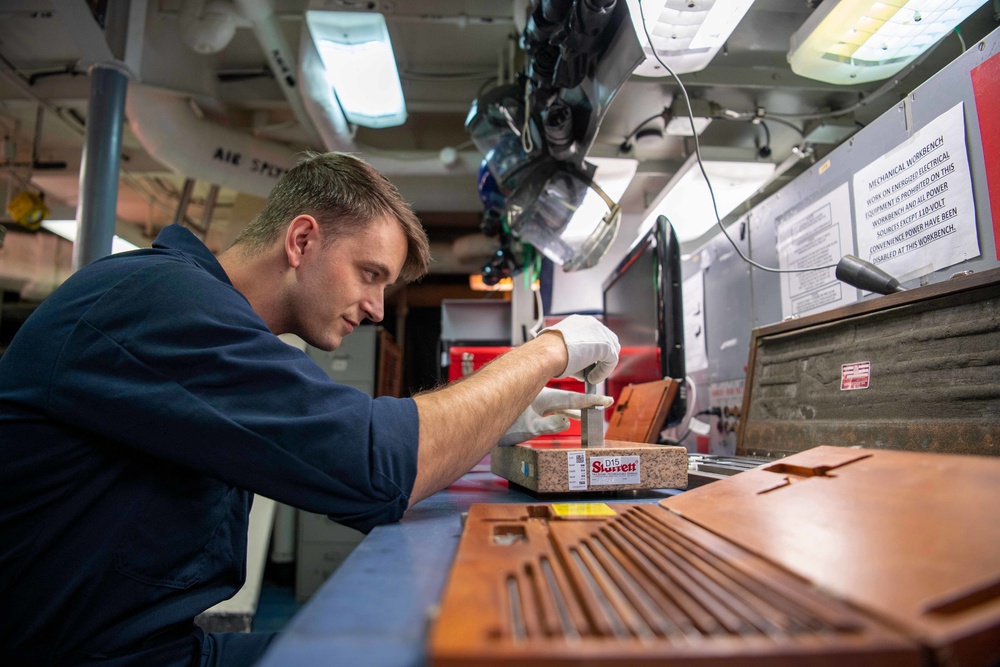 Sailor Calibrates Depth Micrometer
