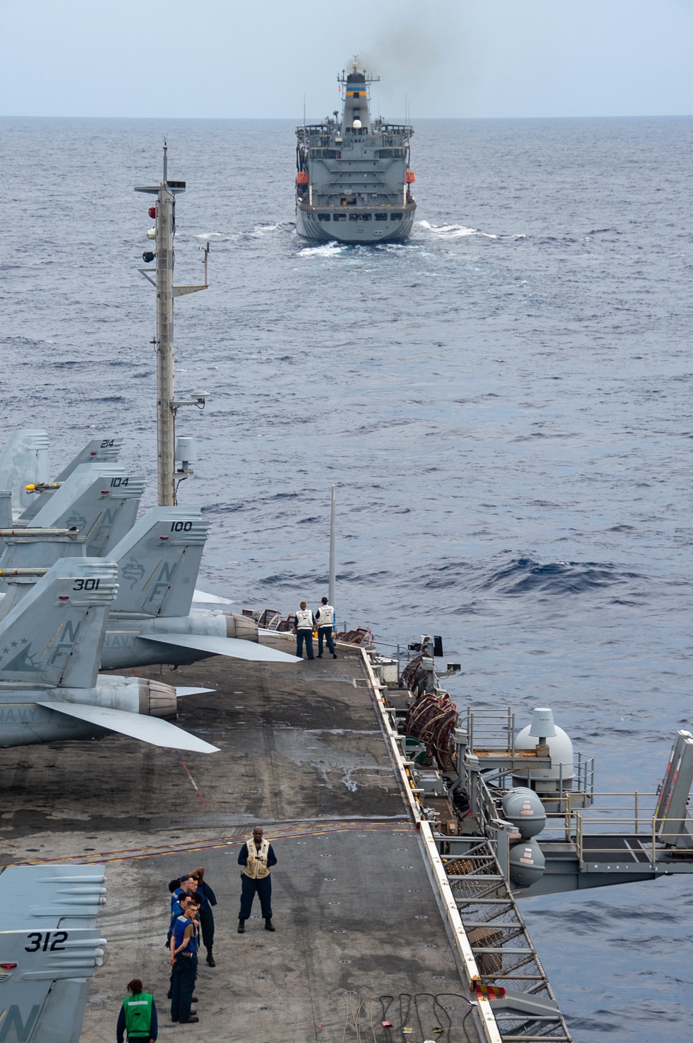 USS Ronald Reagan (CVN 76) conducts replenishment-at-sea with USNS Yukon (T-AO-202)