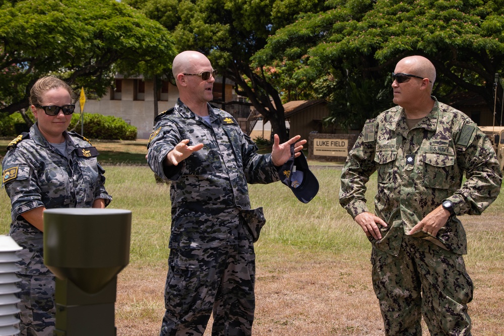 U.S. Marines with ATC Co. M discuss meteorology and oceanography with U.S. Navy and the Royal Australian Navy during RIMPAC 2022