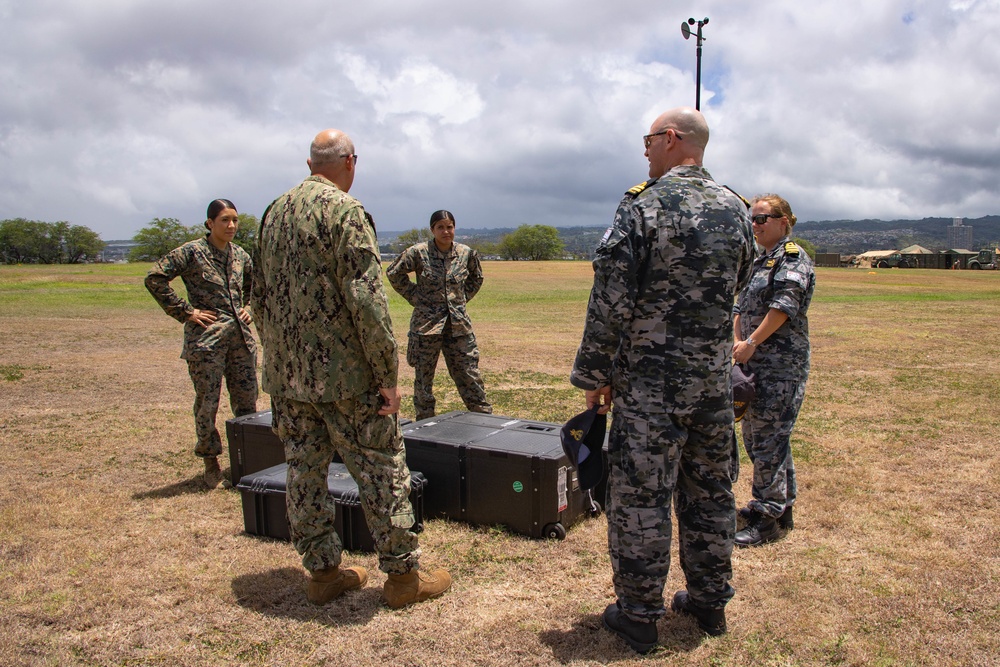 U.S. Marines with ATC Co. M discuss meteorology and oceanography with U.S. Navy and the Royal Australian Navy during RIMPAC 2022