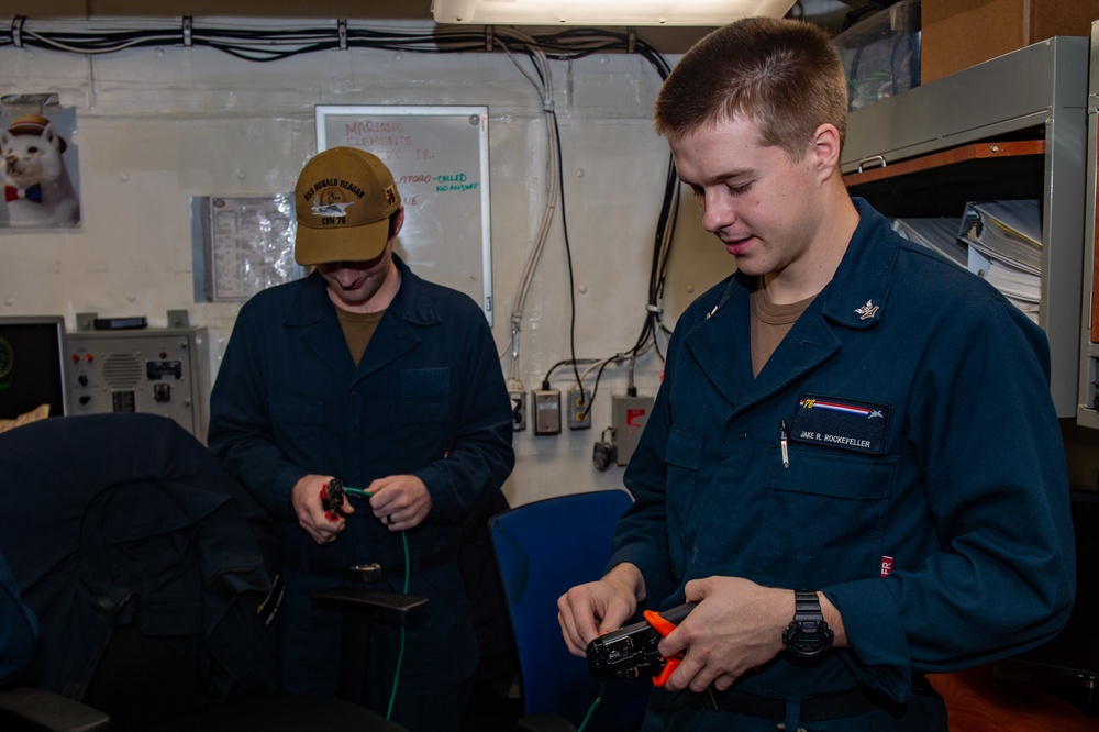 USS Ronald Reagan (CVN 76) Sailors operate advanced data processing shop