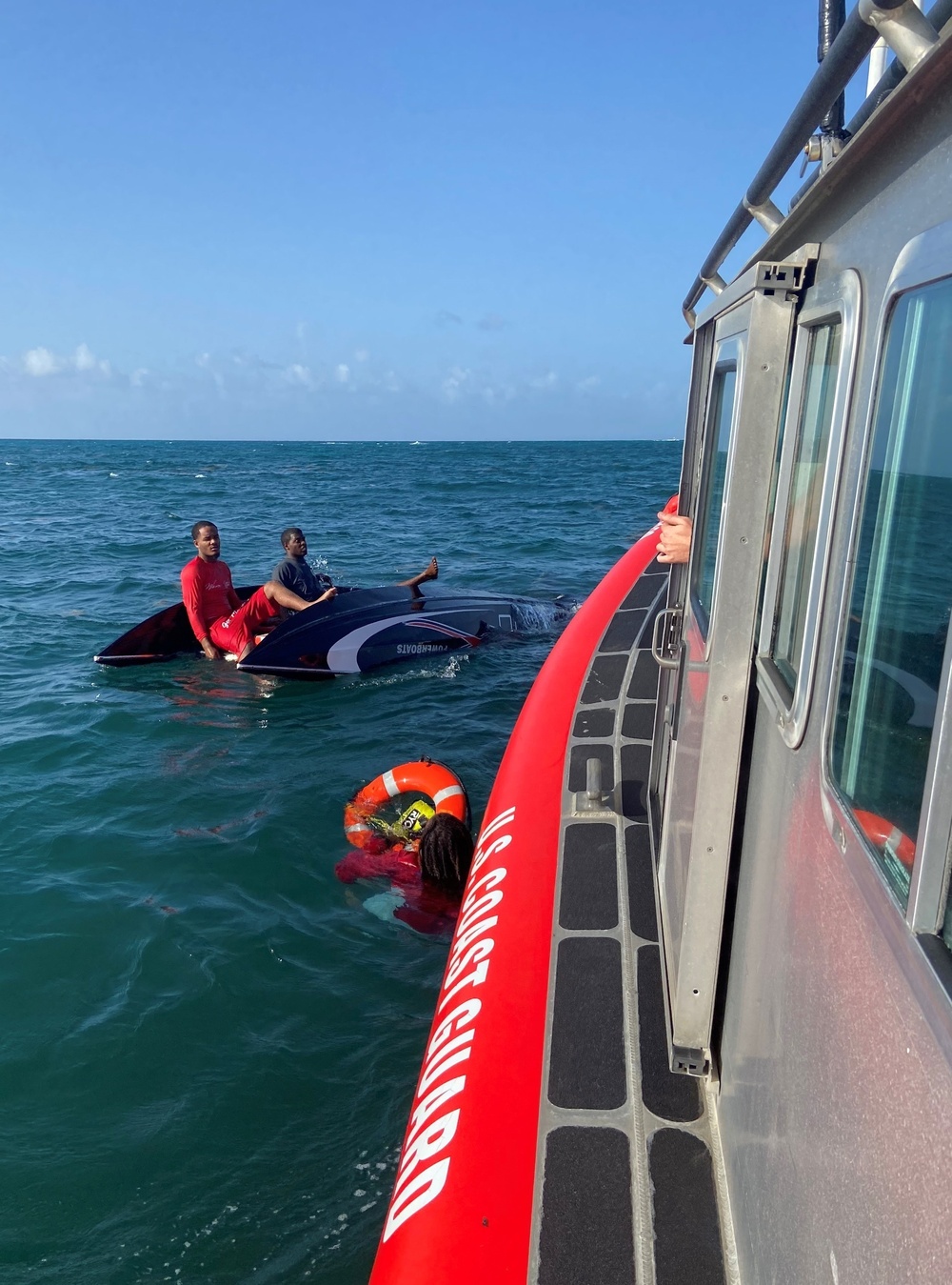 Coast Guard crew, 2 Good Samaritan vessels rescue 5 persons following capsizing near Green Cay Marina in St. Croix, U.S. Virgin Islands