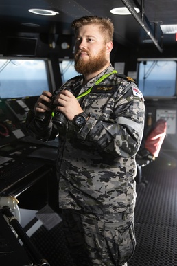 RAN Sailor stands watch aboard HMAS Canberra during RIMPAC 2022