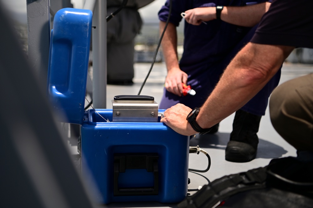 NSWC Corona Technicians install ITU BLOS tracker systems for RIMPAC 2022