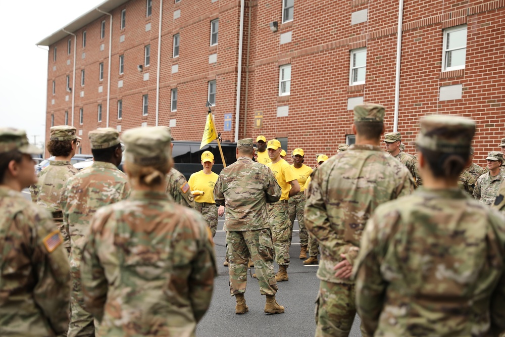 Warrant Officer Candidate School holds sign, song and hat ceremony