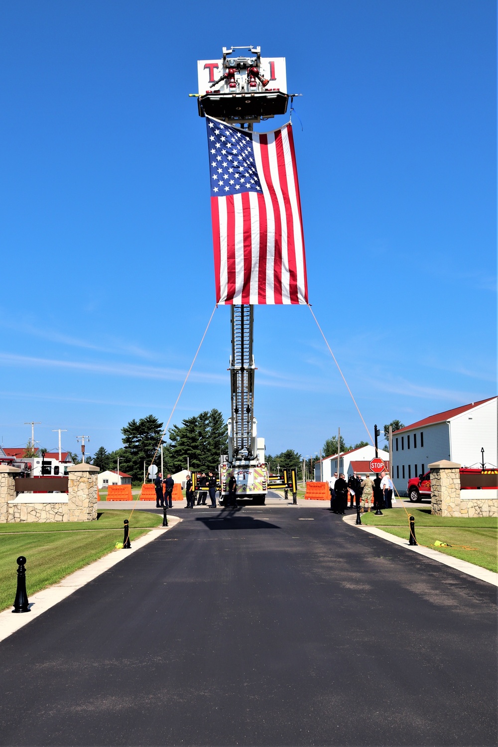 Firefighters and the American flag for Fort McCoy Garrison Change of Command ceremony