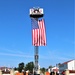 Firefighters and the American flag for Fort McCoy Garrison Change of Command ceremony