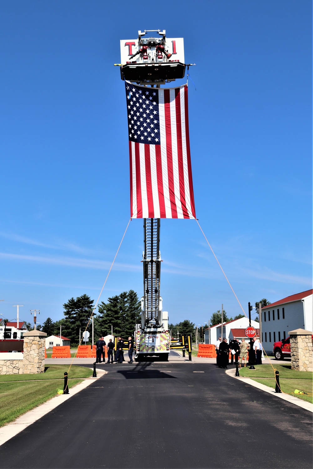 Firefighters and the American flag for Fort McCoy Garrison Change of Command ceremony
