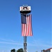Firefighters and the American flag for Fort McCoy Garrison Change of Command ceremony