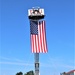 Firefighters and the American flag for Fort McCoy Garrison Change of Command ceremony