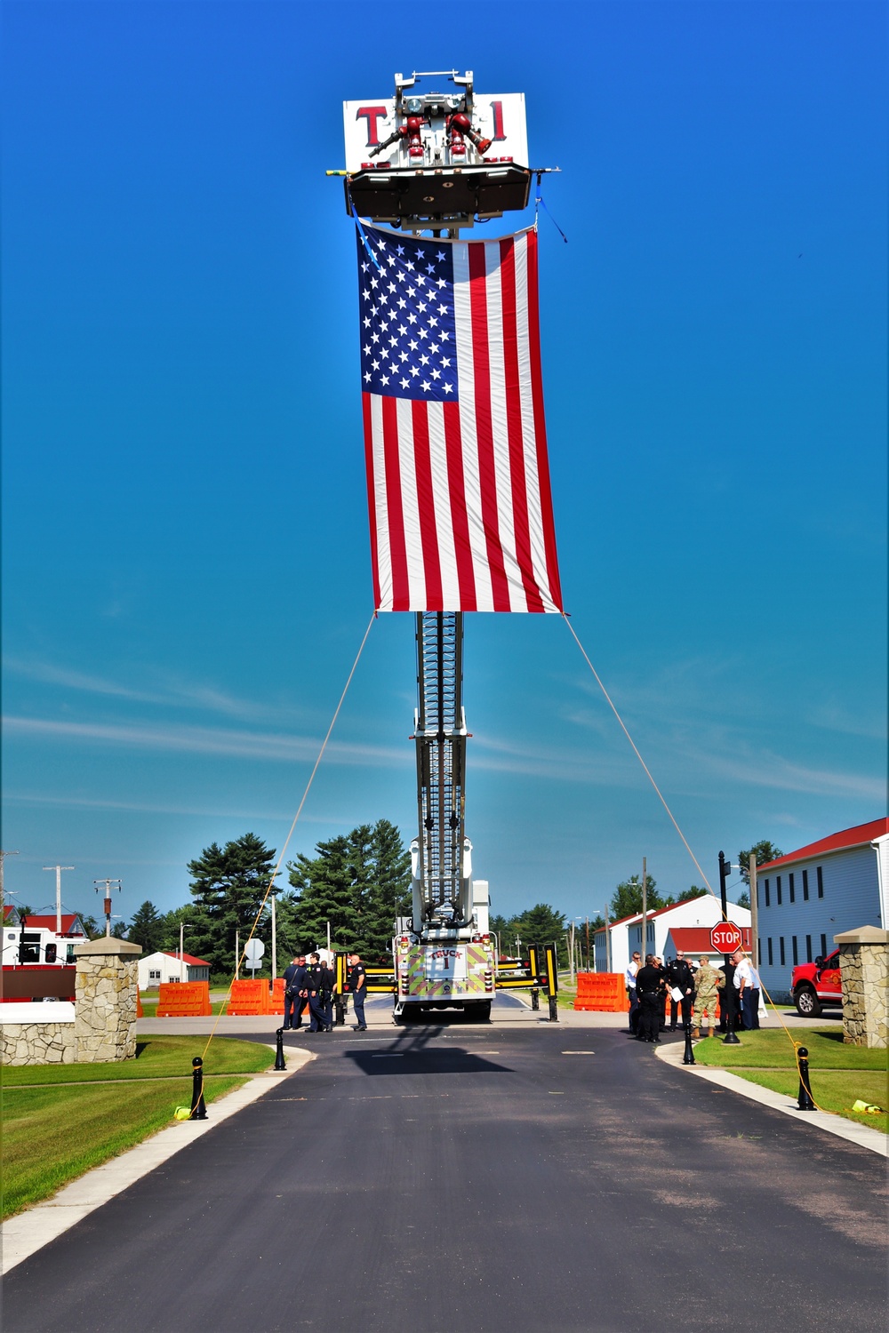 Firefighters and the American flag for Fort McCoy Garrison Change of Command ceremony