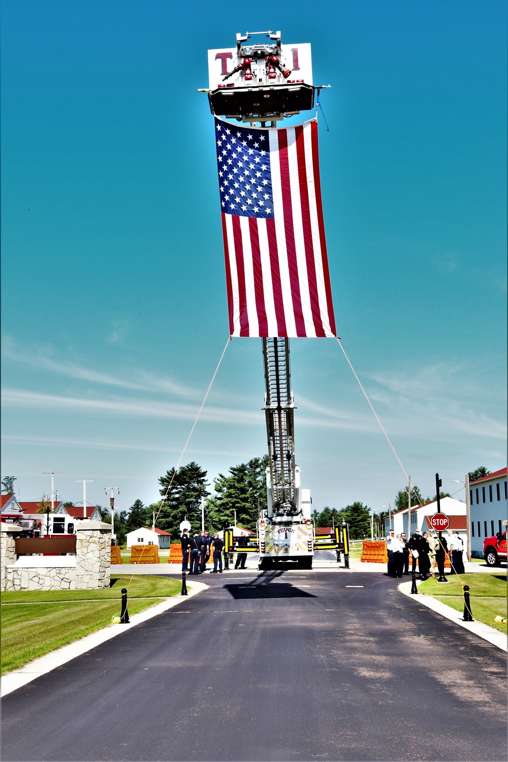 Firefighters and the American flag for Fort McCoy Garrison Change of Command ceremony