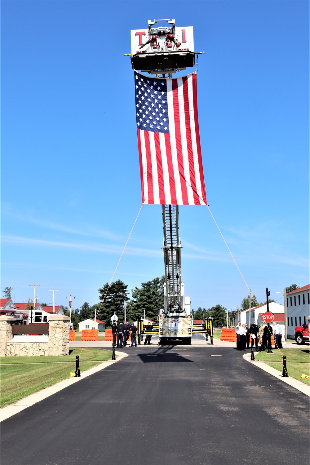 Firefighters and the American flag for Fort McCoy Garrison Change of Command ceremony